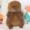 Peluche Capibara con bufanda y manta